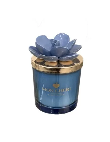 candela profumata a bicchiere in vetro con fiore decorativo blu